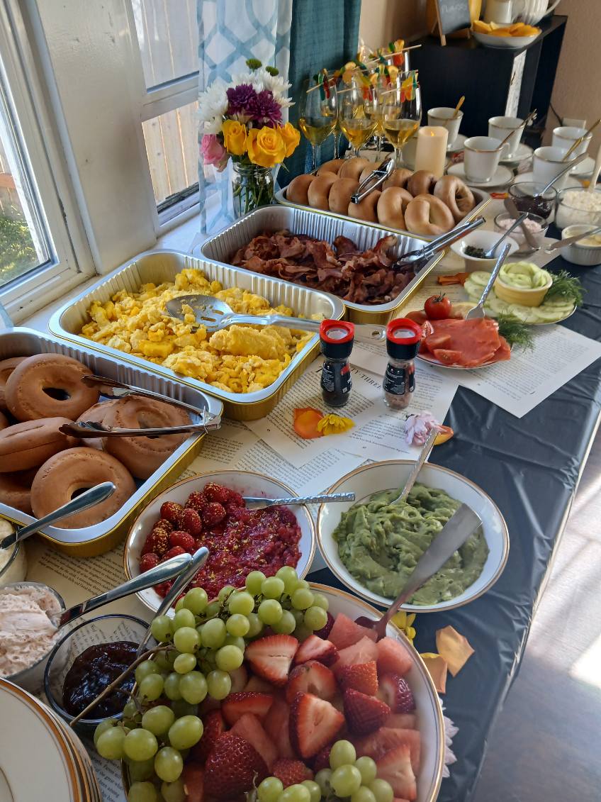 Brunch table with fresh food and place settings